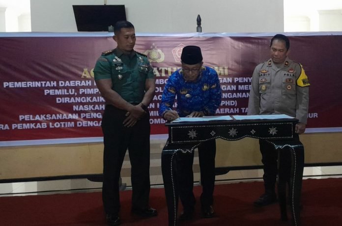 H.M.Juaini Taofik Teken NPHD dan Tekankan ASN Kedepankan Netralitas Dalam Pemilu 2024